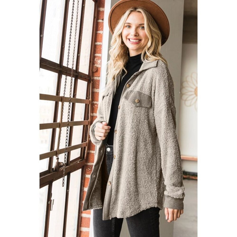 A soft solid shacket featuring a french terry contrast, collar